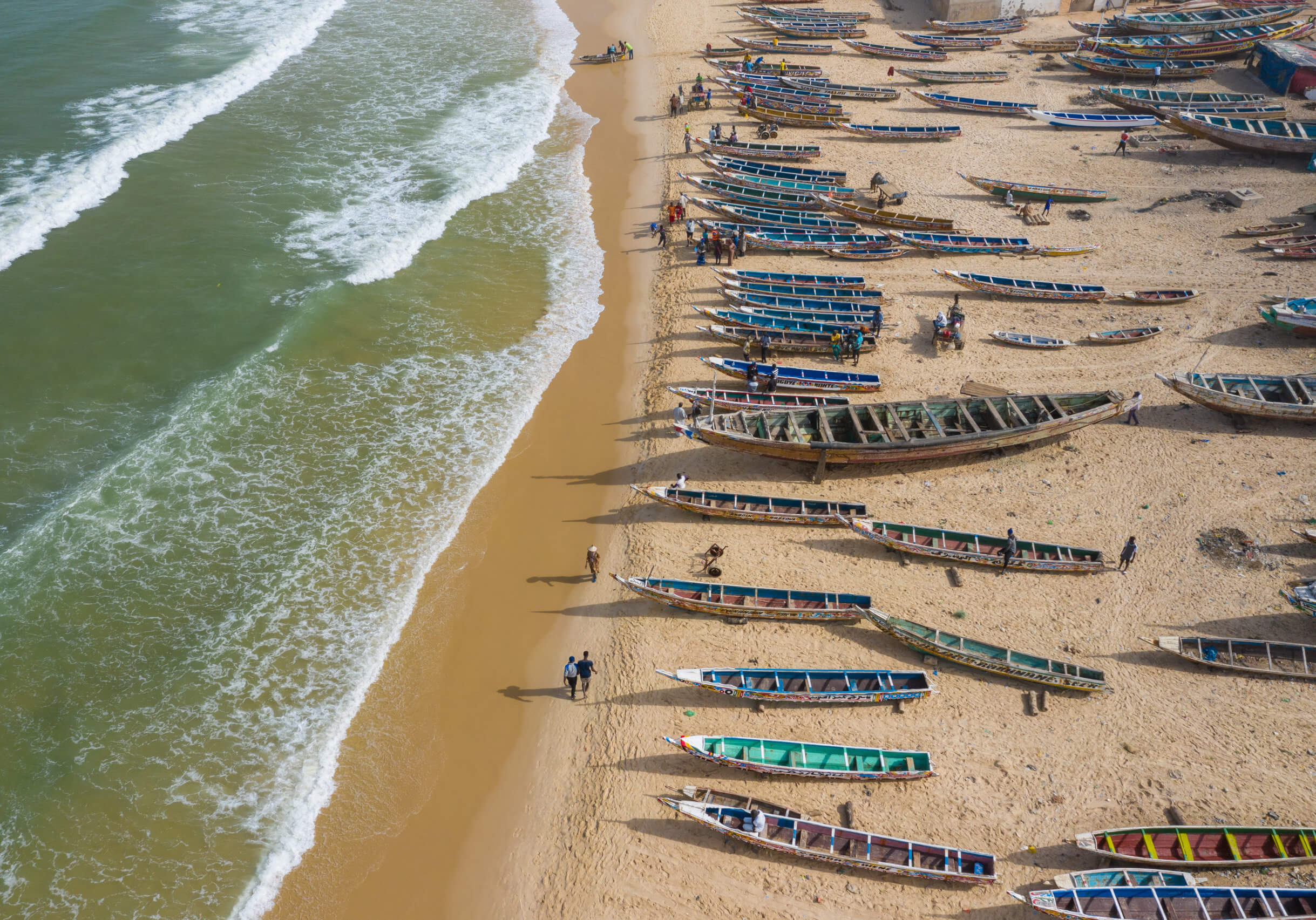 Aerial view of fishing village, pirogues fishing boats in Kayar, Senegal.  Photo made by drone from above. Africa Landscapes.